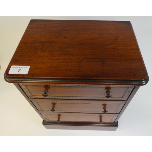 7 - A late 19thC mahogany table top collector's chest with three graduated long drawers and inlaid borde... 