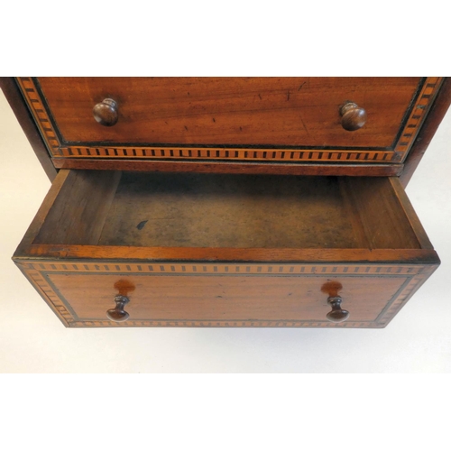 7 - A late 19thC mahogany table top collector's chest with three graduated long drawers and inlaid borde... 