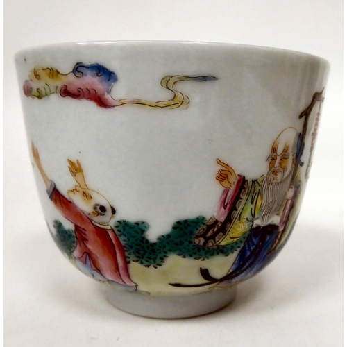 77 - A 19thC Chinese porcelain footed tea bowl, decorated in famille rose with a sage and a boy at play&n... 