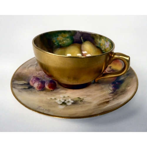 79 - A Royal Worcester china cabinet cup and saucer with soft fruit and gilding  bears the signature... 