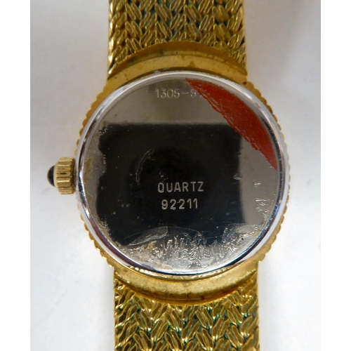 82 - A Favre - Leuba bracelet wristwatch of oval form with a textured strap, the quartz movement faced by... 