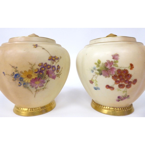 84 - A matched pair of Royal Worcester blush ivory glazed and gilded china jars of melon design, decorate... 