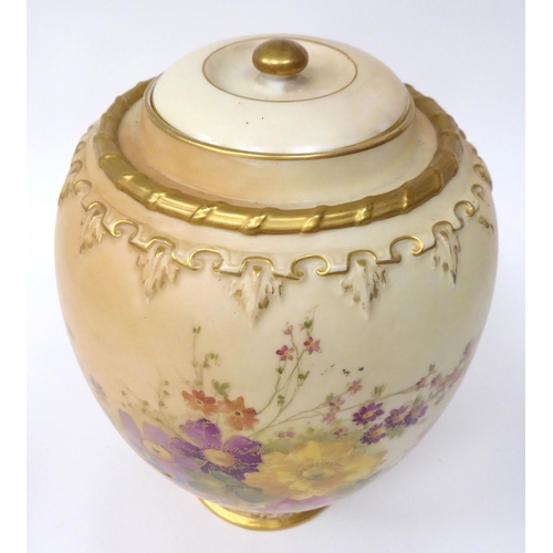 85 - A Royal Worcester blush ivory glazed and gilded china jar of baluster form, decorated with mixed flo... 