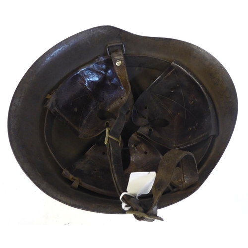 86 - An Italian grey painted steel Civil War Volunteers helmet with a hide liner and buckled chinstrap, b... 