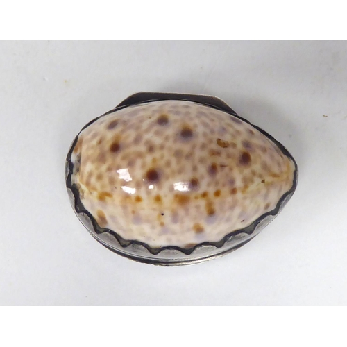 90 - A part conch shell oval vinaigrette with a silver mounted hinged lid, enclosing a gilded, engraved a... 