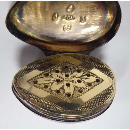 90 - A part conch shell oval vinaigrette with a silver mounted hinged lid, enclosing a gilded, engraved a... 