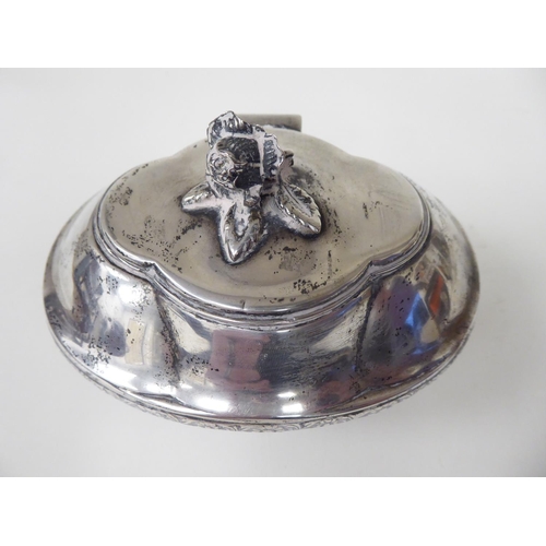 94 - A late 19thC Continental silver coloured metal jewellery box of oval bowl form with an outset, hinge... 