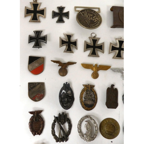 97 - German World War II/Third Reich related collectables, some copies: to include enamelled swastika bad... 