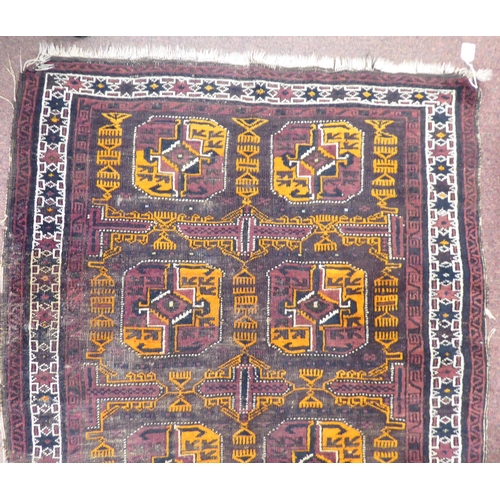 116 - A North African woven woollen rug, decorated in geometric forms, on a multi-coloured ground  51