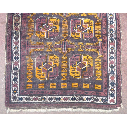 116 - A North African woven woollen rug, decorated in geometric forms, on a multi-coloured ground  51