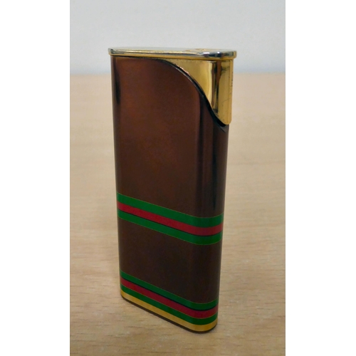 117 - A Gucci pocket lighter from their Accessory Collection  boxed