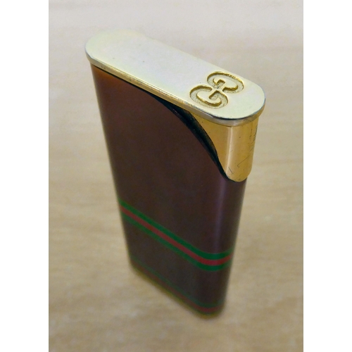 117 - A Gucci pocket lighter from their Accessory Collection  boxed