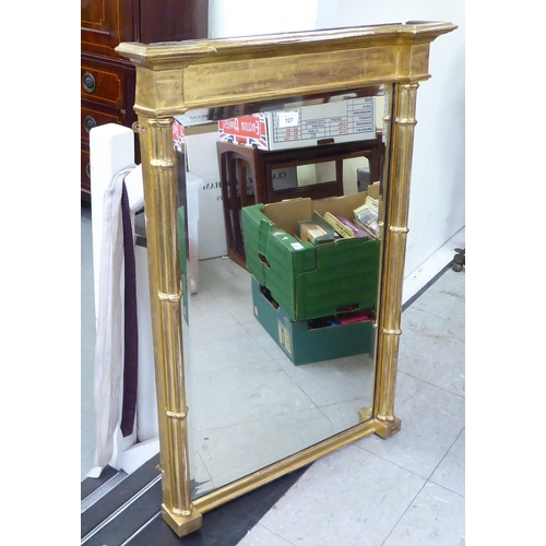 127 - An early 19thC gilt framed breakfront pier glass with cluster pilasters  32