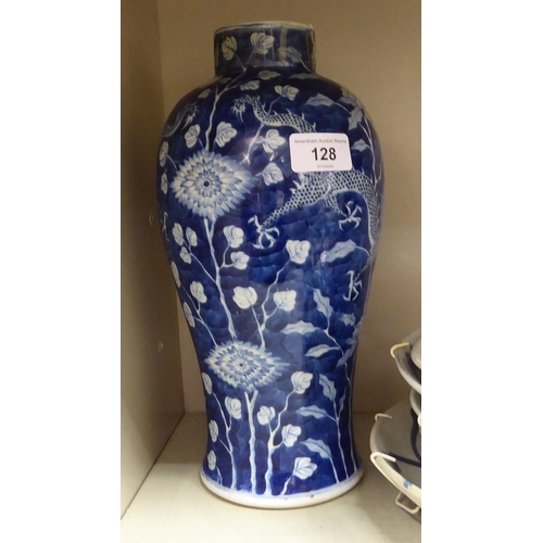 128 - Oriental ceramics: to include a late 19thC Chinese porcelain vase, decorated with flowers and dragon... 