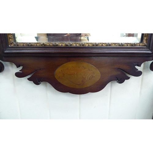 129 - A Regency mahogany framed mirror with a pierced Ho Ho bird crest  36