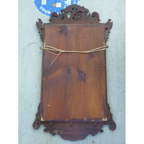 129 - A Regency mahogany framed mirror with a pierced Ho Ho bird crest  36