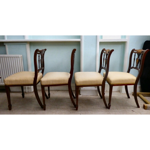 13 - A set of four Edwardian string inlaid, marquetry mahogany dining chairs with later fabric upholstere... 