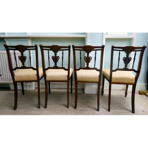 13 - A set of four Edwardian string inlaid, marquetry mahogany dining chairs with later fabric upholstere... 