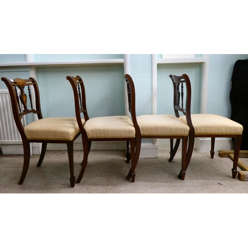 13 - A set of four Edwardian string inlaid, marquetry mahogany dining chairs with later fabric upholstere... 