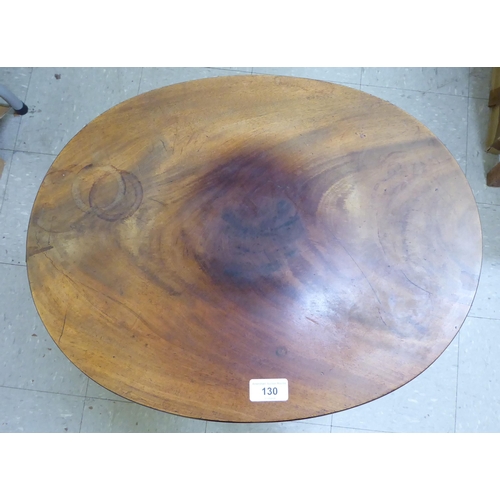 130 - A Regency mahogany work table with a hinged top, raised on a tripod base  29