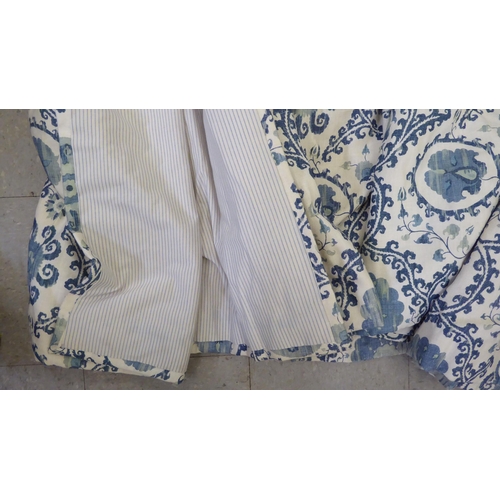 131 - Curtains: to include four, decorated in blue and beige flora  approx. size 93