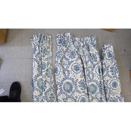 131 - Curtains: to include four, decorated in blue and beige flora  approx. size 93