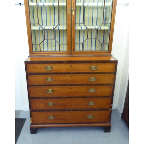 139 - A Regency rosewood crossbanded satinwood cabinet on chest with two astragal glazed doors, over five ... 