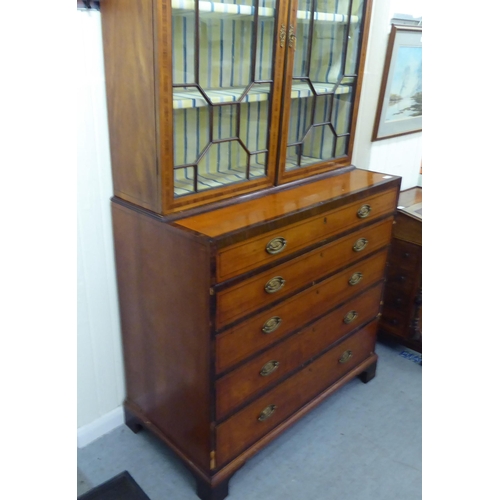 139 - A Regency rosewood crossbanded satinwood cabinet on chest with two astragal glazed doors, over five ... 