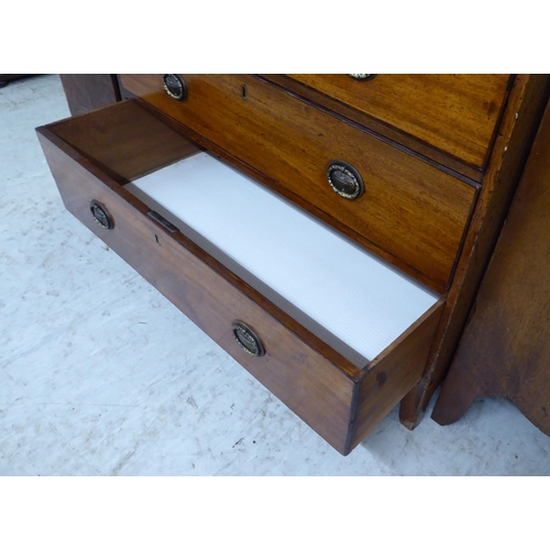 150 - A 19thC mahogany dressing chest with two short/three graduated long drawers and oval brass handles, ... 