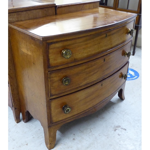 164 - A mid Victorian mahogany bow front dressing chest, the crossbanded top over three graduated long dra... 