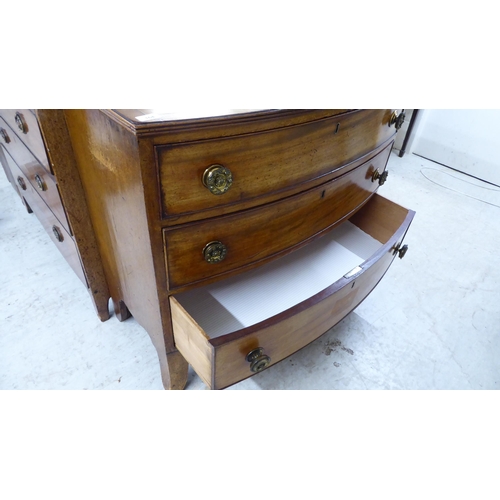 164 - A mid Victorian mahogany bow front dressing chest, the crossbanded top over three graduated long dra... 