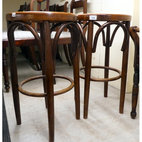 179 - Small furniture, viz. an Edwardian mahogany music stool with a box top and flank handles; and a set ... 