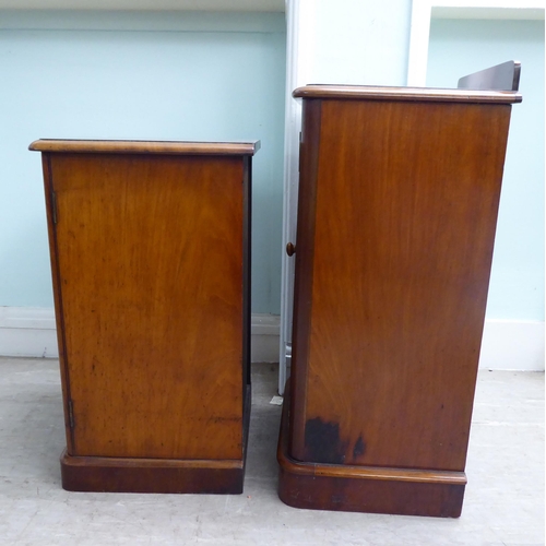 18 - Two similar late Victorian, mahogany single door bedside cupboards, on a plinth  30