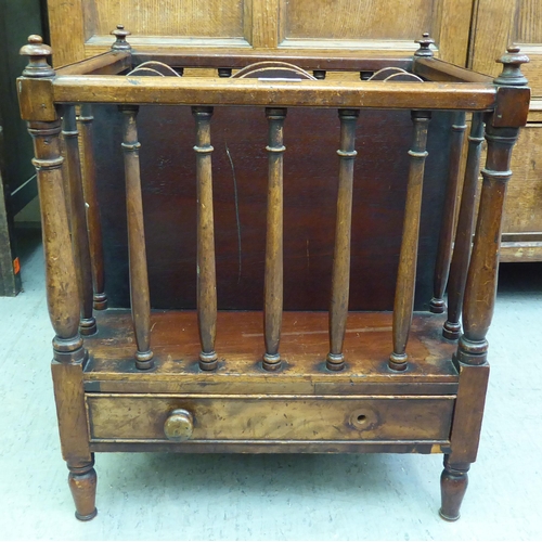 181 - A late Victorian mahogany Canterbury with turned, pillared sides and turned legs  20