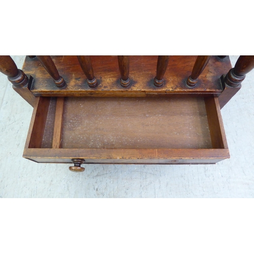 181 - A late Victorian mahogany Canterbury with turned, pillared sides and turned legs  20