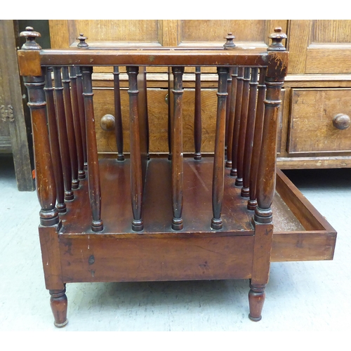 181 - A late Victorian mahogany Canterbury with turned, pillared sides and turned legs  20