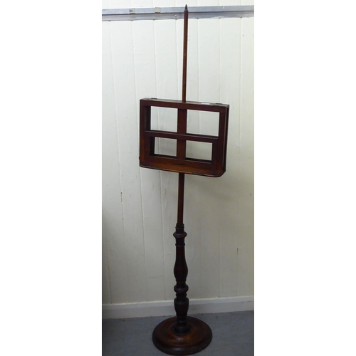 186 - A late Victorian mahogany duet music stand, raised on a height adjustable pillar and circular foot&n... 