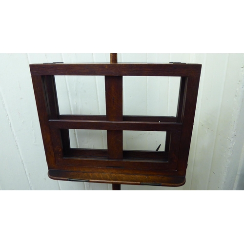 186 - A late Victorian mahogany duet music stand, raised on a height adjustable pillar and circular foot&n... 