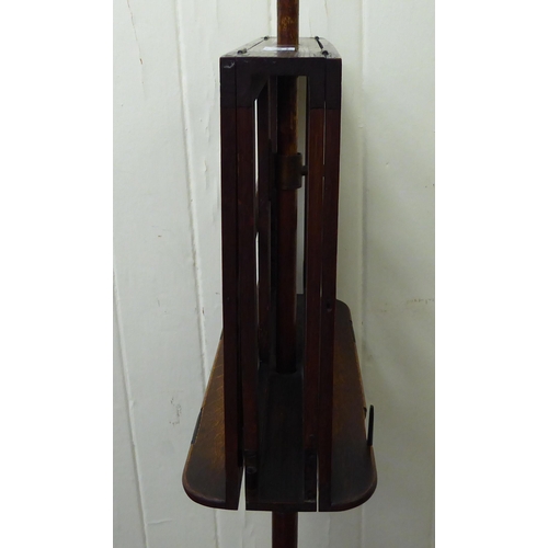 186 - A late Victorian mahogany duet music stand, raised on a height adjustable pillar and circular foot&n... 