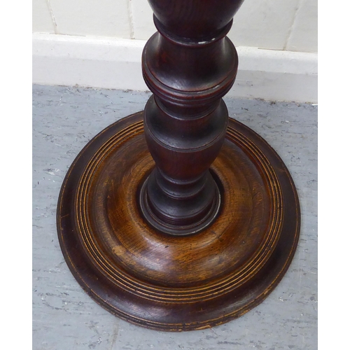 186 - A late Victorian mahogany duet music stand, raised on a height adjustable pillar and circular foot&n... 