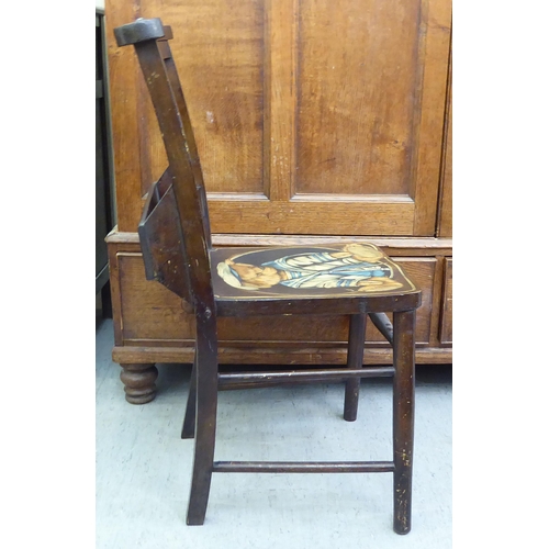 191 - A modern mahogany finished chapel chair with a painted seat, fashioned as a Teddy bear