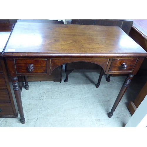 196 - An early Victorian mahogany kneehole writing table, comprising a pair of drawers with bun handles, r... 