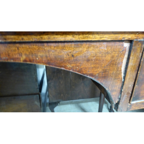 196 - An early Victorian mahogany kneehole writing table, comprising a pair of drawers with bun handles, r... 