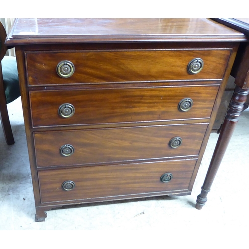 197 - A mid 19thC mahogany chest, comprising four graduated drawers with brass ring handles, raised on bra... 