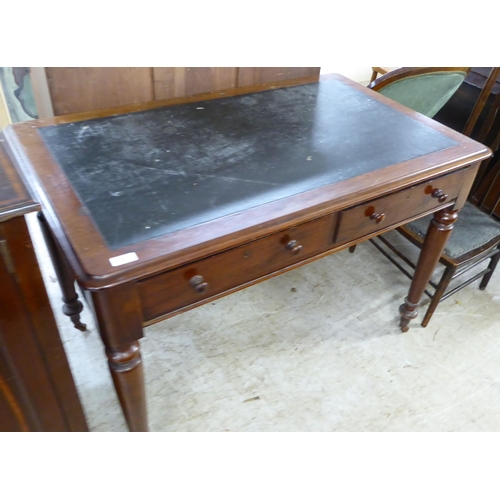 201 - A mid 19thC mahogany writing table, the rexine scriber over a pair of inline drawers with bun handle... 