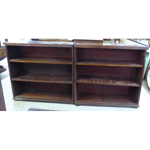 207 - A pair of mid 19thC rosewood library dwarf bookcases, each comprising three height adjustable shelve... 