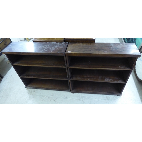 207 - A pair of mid 19thC rosewood library dwarf bookcases, each comprising three height adjustable shelve... 