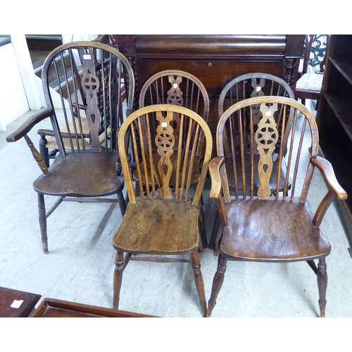 213 - Five early 20thC beech and elm framed Windsor hoop back chairs: to include a high back arm chair