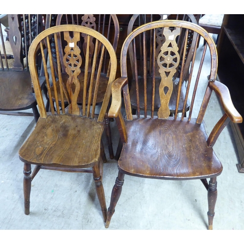 213 - Five early 20thC beech and elm framed Windsor hoop back chairs: to include a high back arm chair