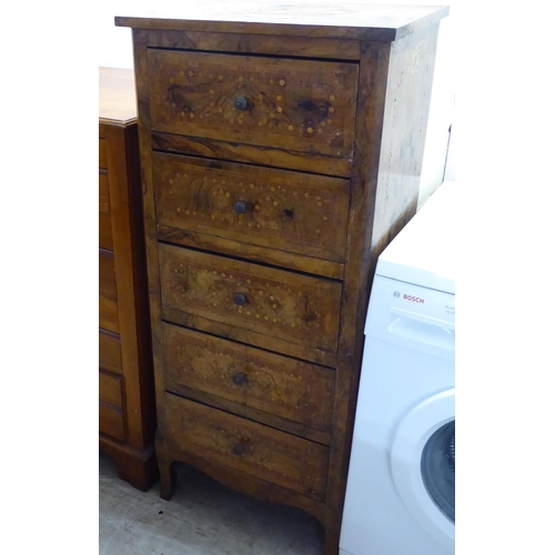 216 - A late 19thC French walnut and profusely inlaid tallboy, comprising five graduated long drawers betw... 